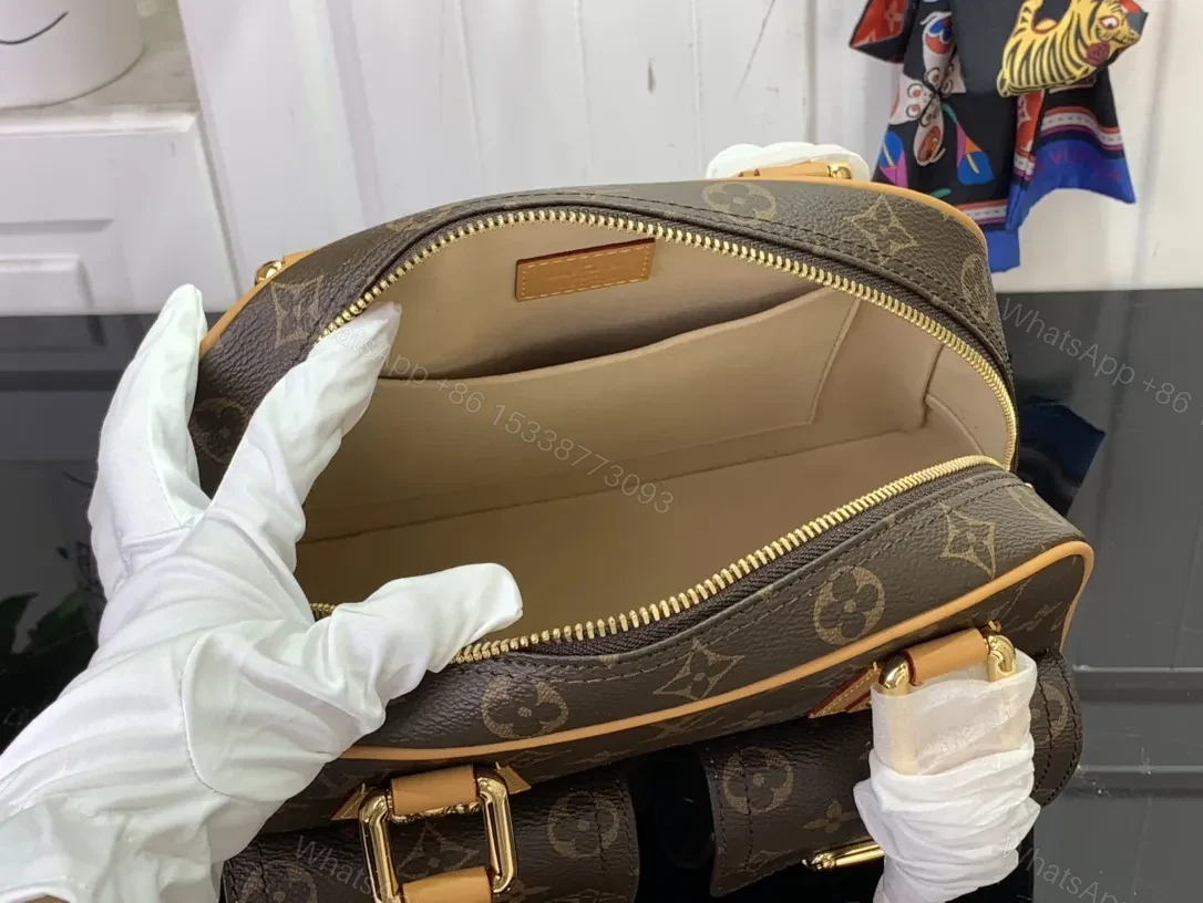 View 6 of Structured Luxury Monogram Handbag with Gold Hardware and Leather Trim