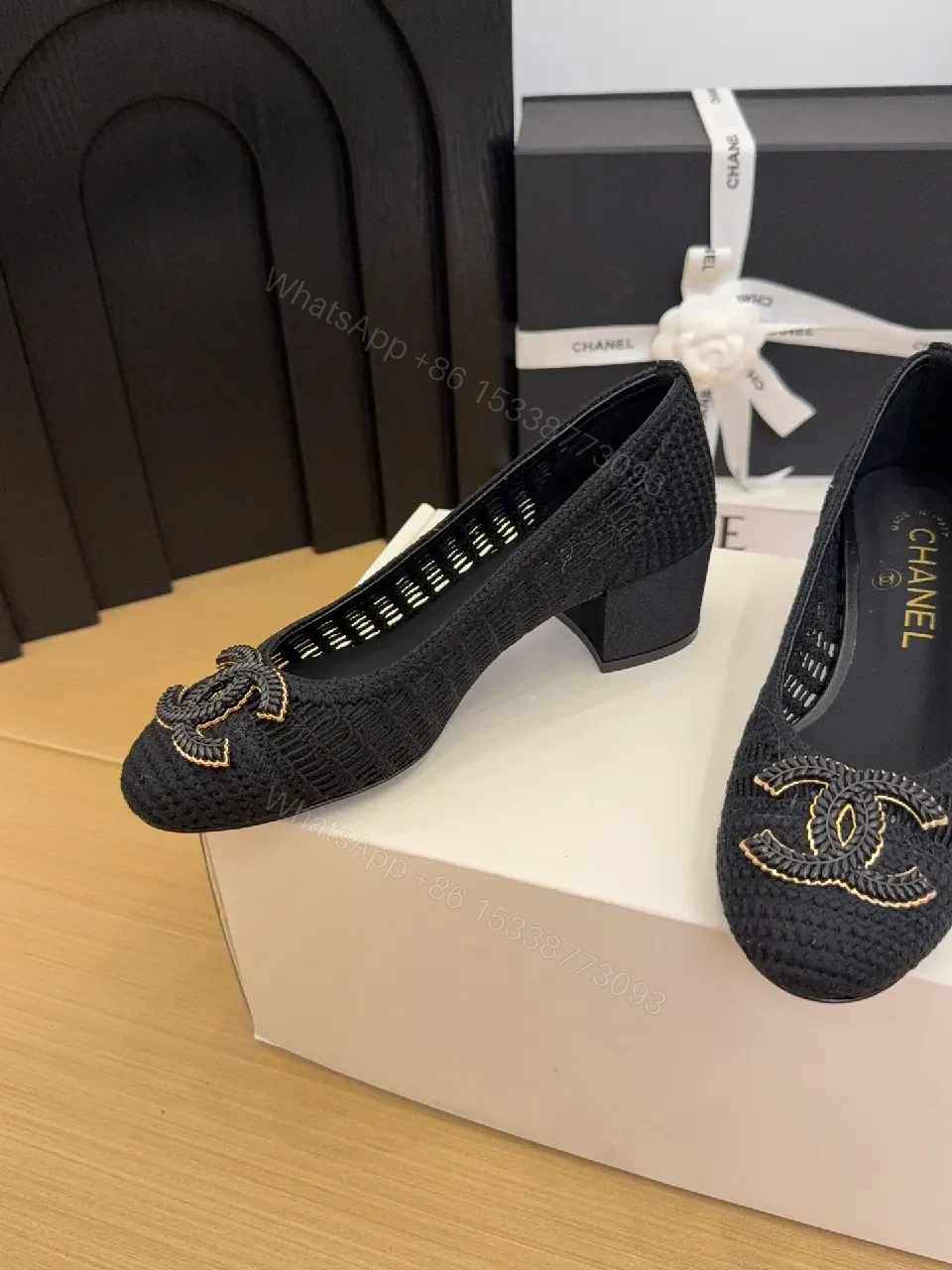 View 9 of Elegant Quilted Black Loafers with Gold Emblem: Everyday Luxury