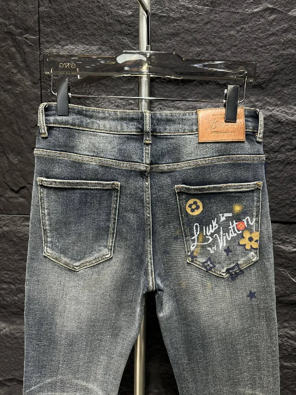 View 9 of Distressed Indigo Jeans with LV-Inspired Embellishments - Denim Luxe style