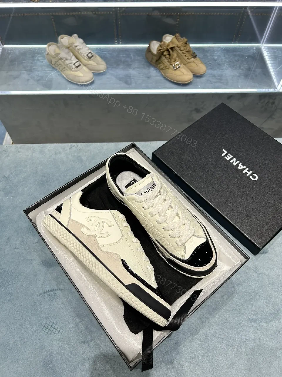 View 3 of Cream Leather Sneaker + Subtle Chanel-Inspired Detail + High-Top Comfort + Timeless Glossy Toe + Sneaker