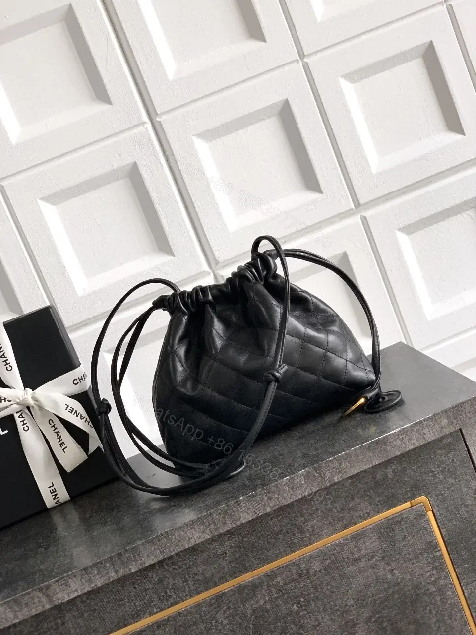 View 10 of Quilted Drawstring Bag - Black Leather-Feel, Gold Accent