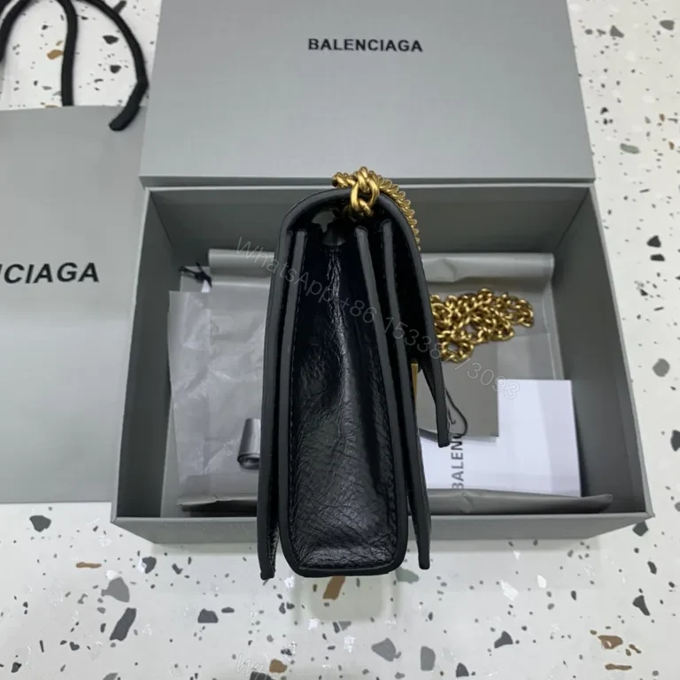 View 6 of Chic Black Leather Mini Bag with Gold B Clasp â€“ Compact Luxury