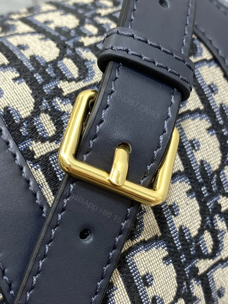View 6 of Structured Luxe Navy Leather Mini Duffle Bag with Monogram Charm
