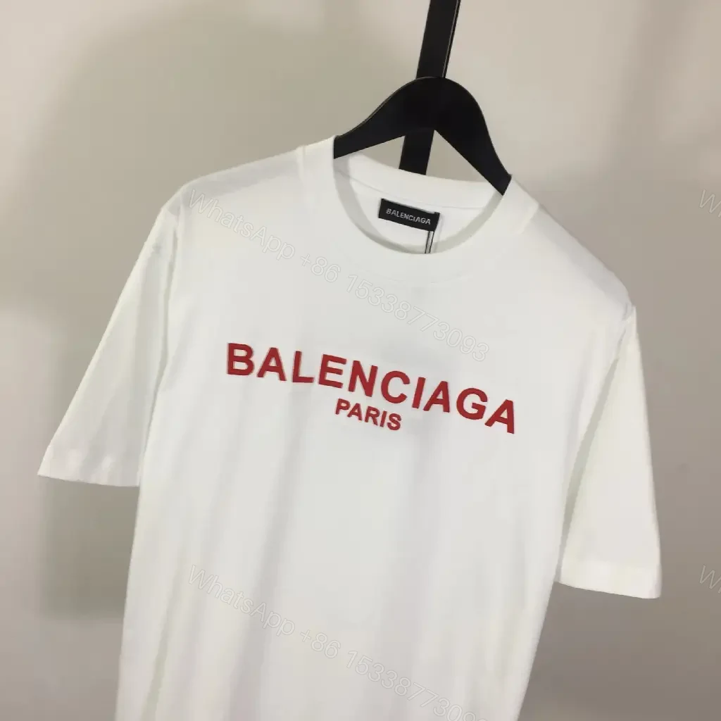View 5 of Minimalist White Logo Tee with Bold Red Crest