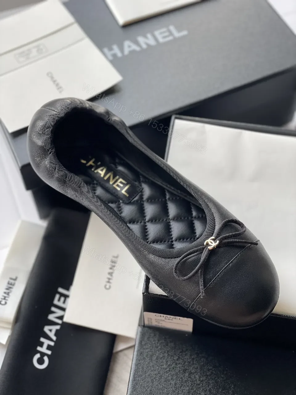 View 9 of Quilted Black Flats with Gold Logo Accents - Chic Comfort