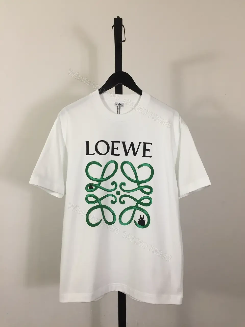 White Cotton Graphic Tee – Opulent Comfort, Bold Logo, Casual Luxury — view 1