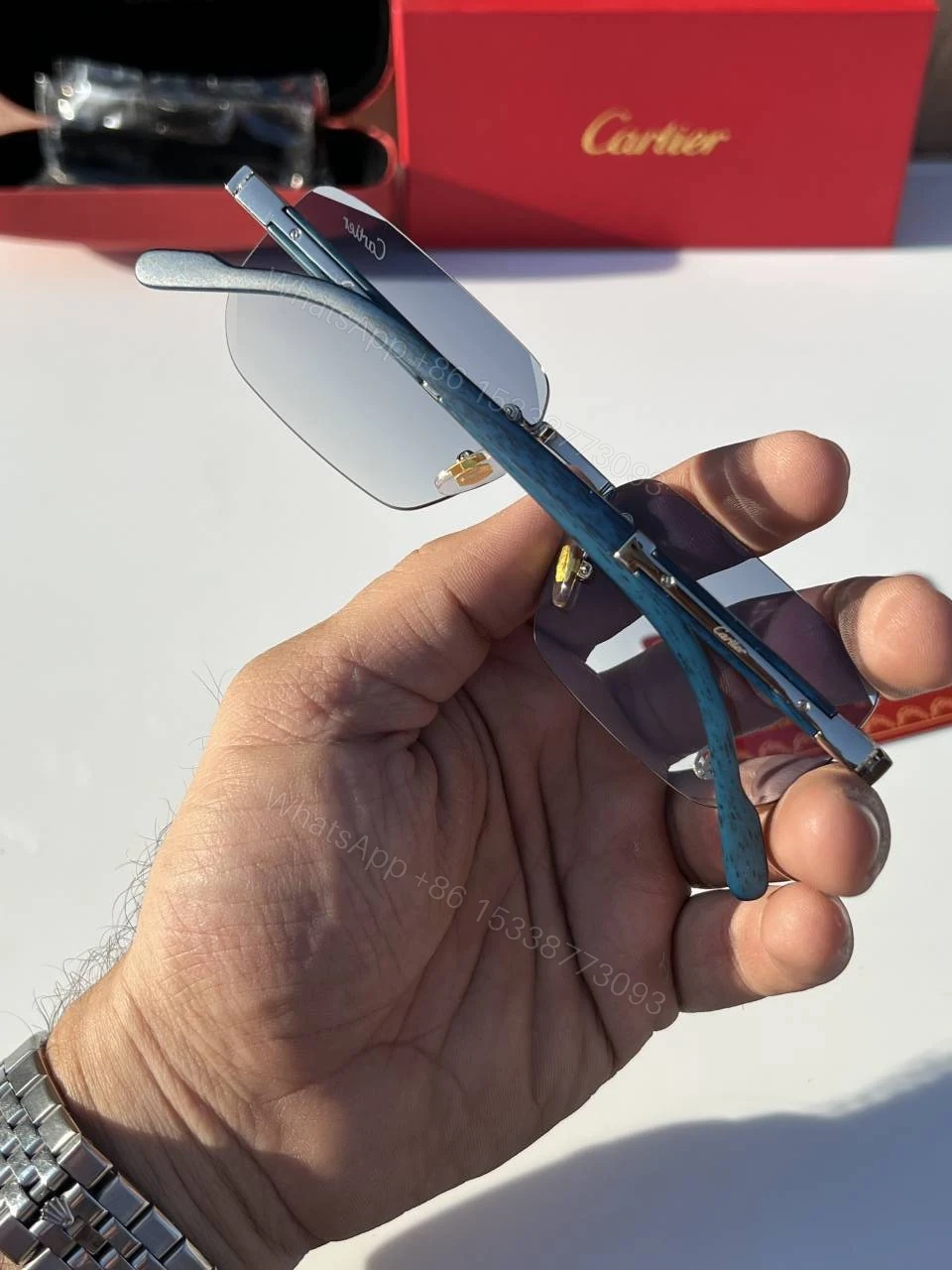 View 4 of First Copy Cartier Rimless Blue Tint Sunglasses Silver Frame Unisex UV Protection