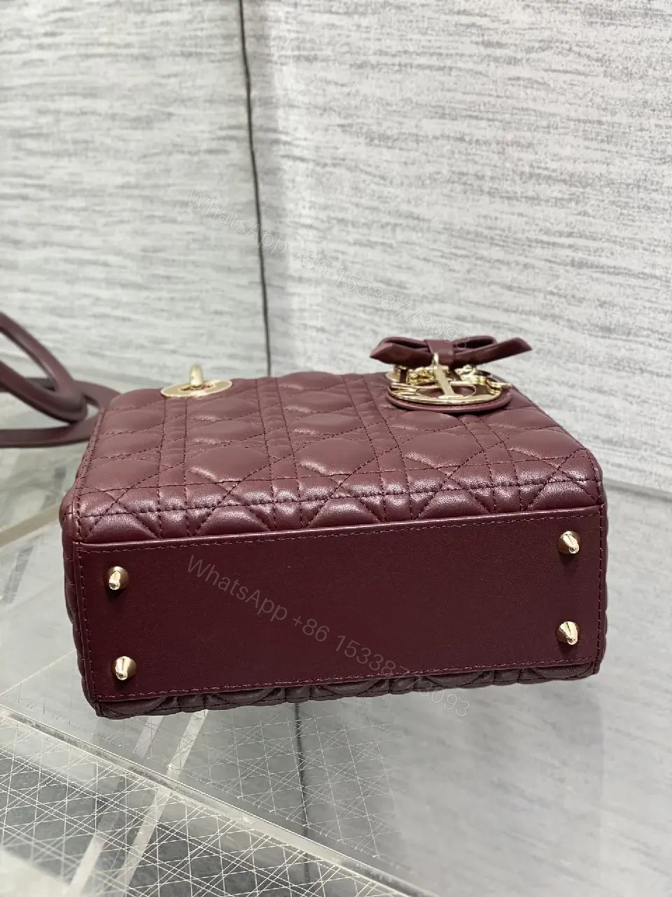View 3 of Quilted Burgundy Handbag with Top Handles, Structured Charm