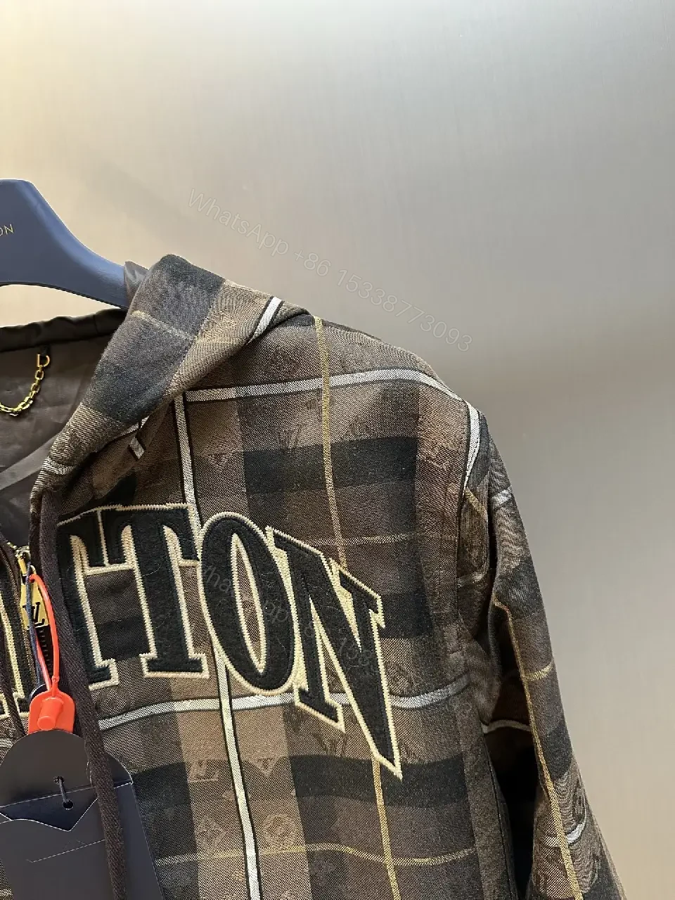 View 6 of Bold Checkered Hoodie Jacket – Luxe Logo Streetwear Comfort