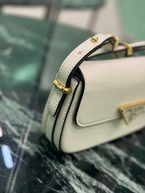 View 3 of Elegant Leather Crossbody Bag: Prada Triangle, Structured Luxury