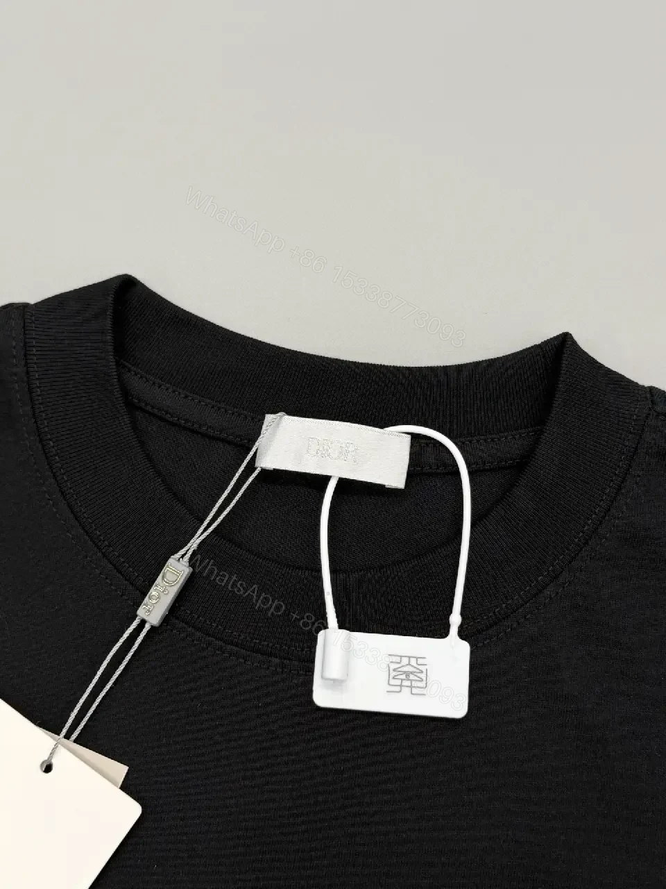 View 10 of Minimalist Black Cotton Tee with Logo Embroidery Luxury Casual Top