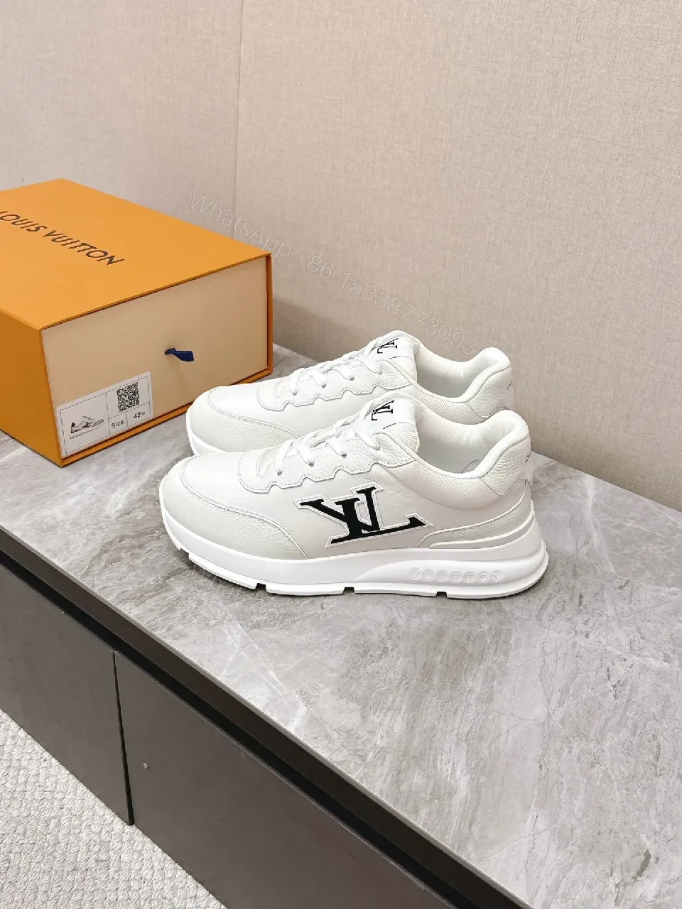 View 3 of White Leather Low-Profile Sneakers with Monogram Detailing