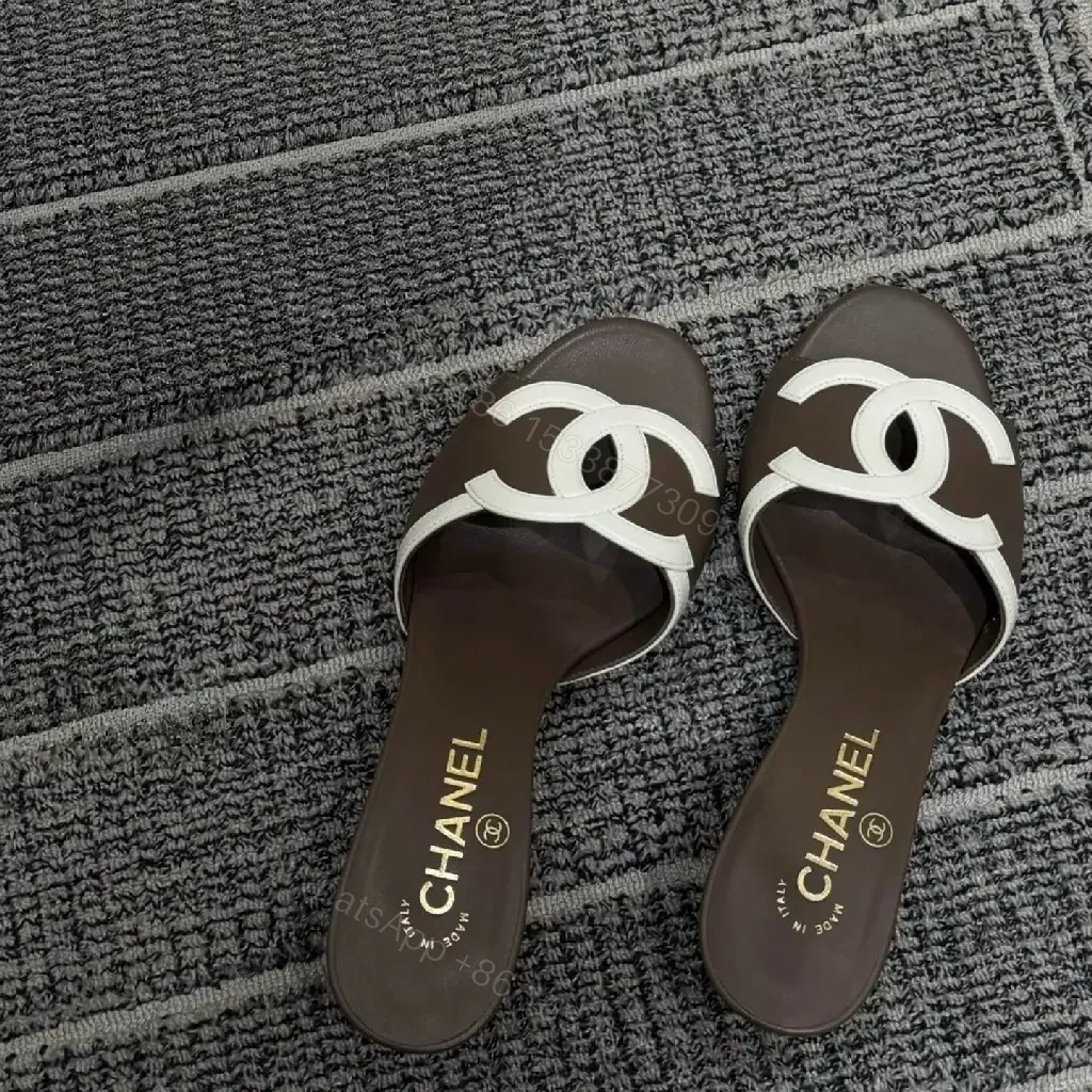 View 2 of Brown Leather Slides White Logo Interlock Chanel Sliders