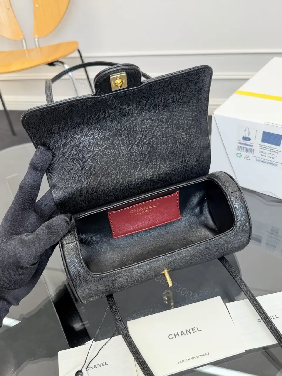 View 9 of Black Grain Leather Crossbody Bag – Gold Twist, Compact & Versatile