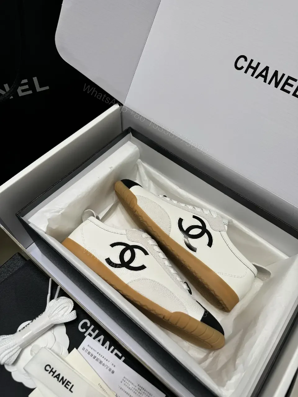 View 2 of Two-Tone White/Black Gum-Soled High-Top Sneakers