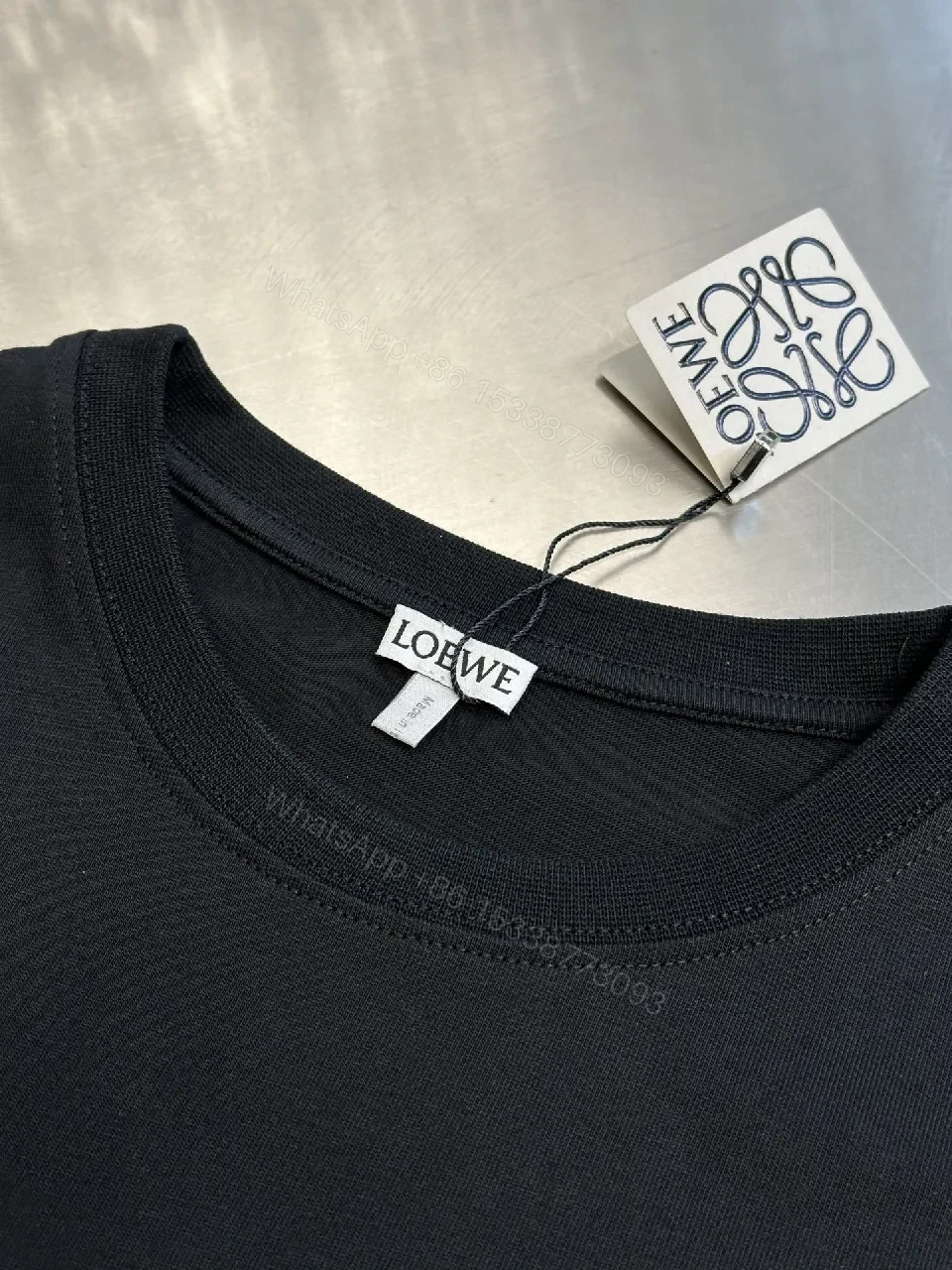 View 4 of Black Minimalist Tee with Chest Pocket - Premium Cotton, Relaxed Fit