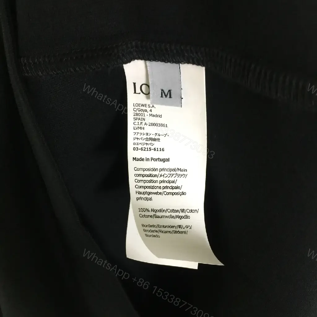 View 7 of Minimalist Black Tee: Subtle Branding, Everyday Luxury Tee