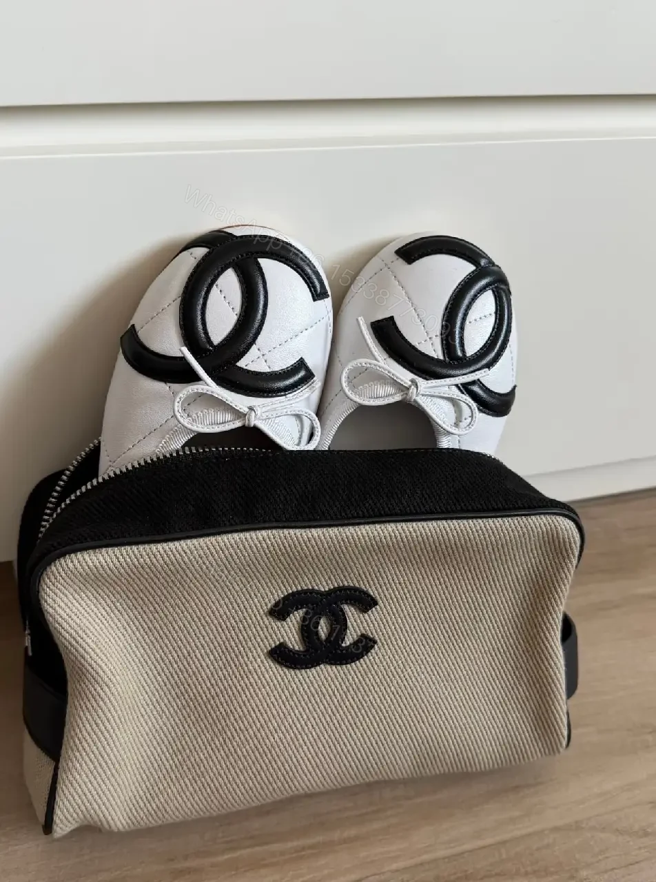 View 3 of Beige Canvas Pouch - Black Trim, Logo, Wrist Strap, Compact