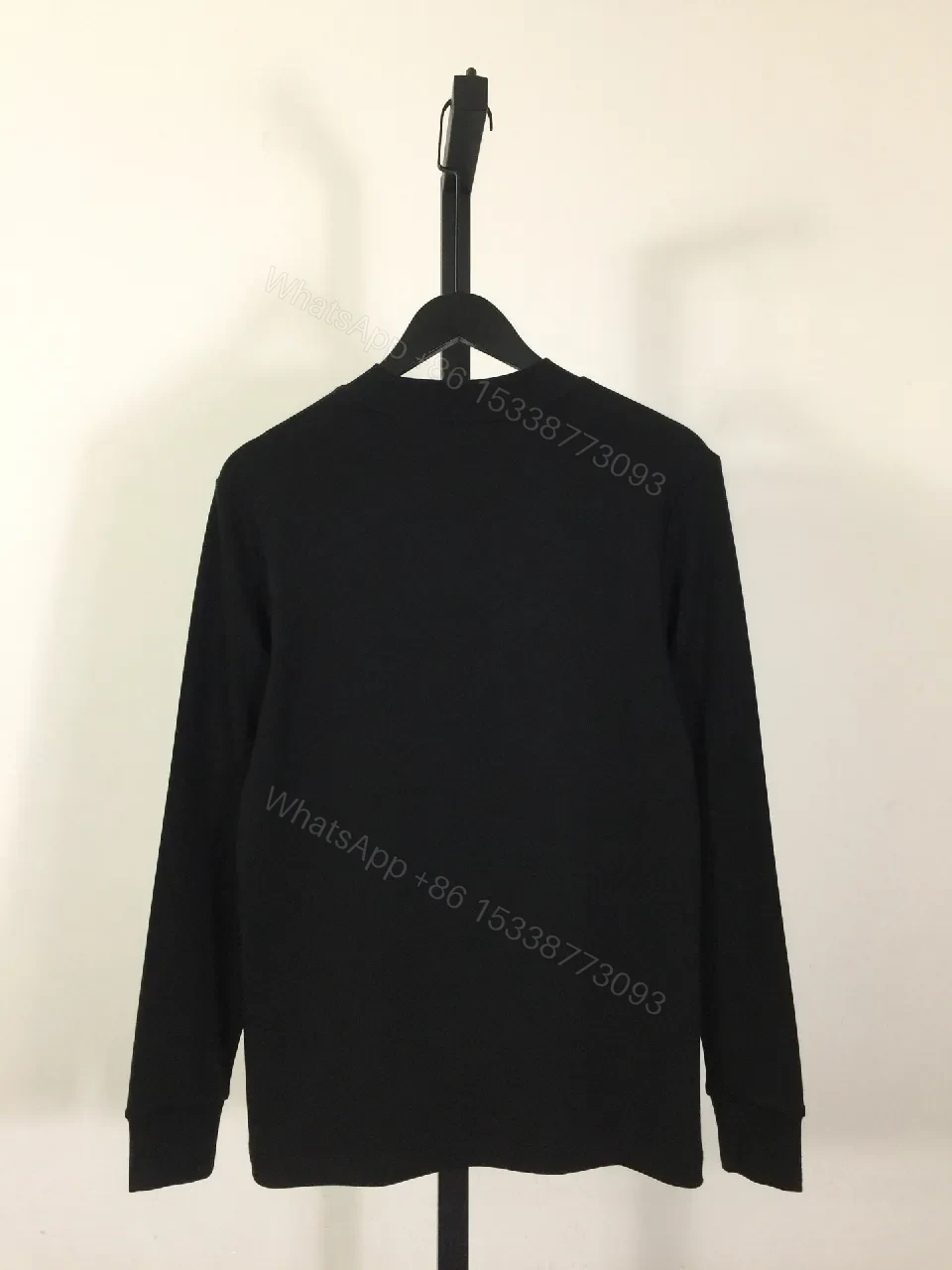 View 7 of Minimalist Black Sweatshirt with Subtle Monogram Accent