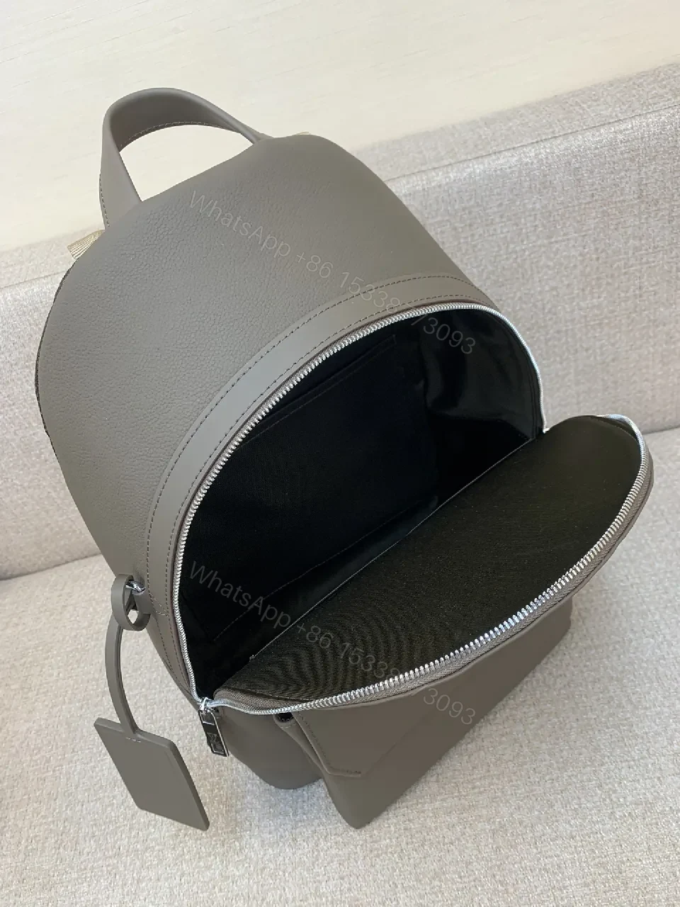 View 4 of Structured Minimalist Leather Backpack with Subtle LV Motif