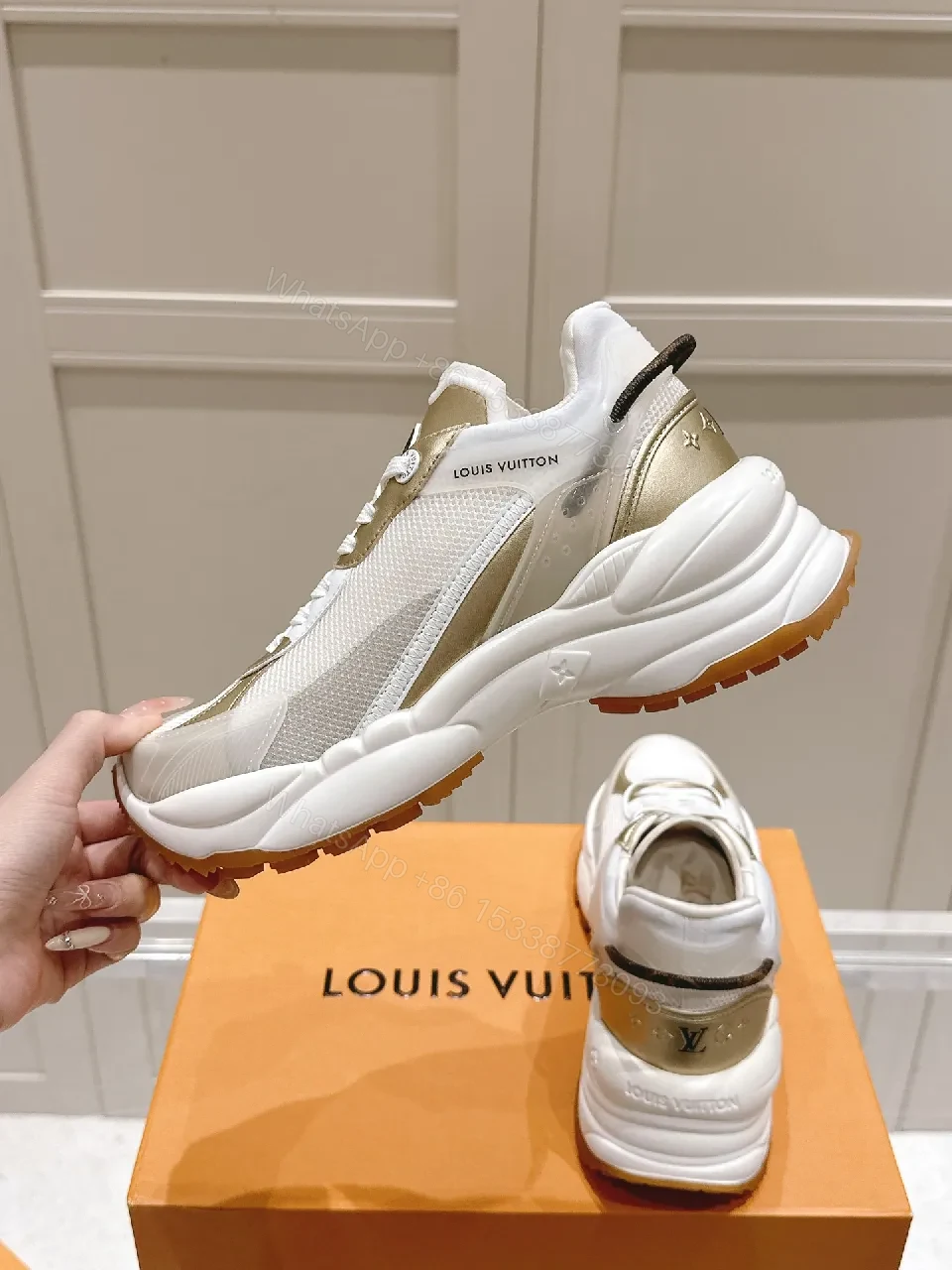 View 2 of Chunky White & Gold Luxe High-Tops: Signature LV Motif Sneakers