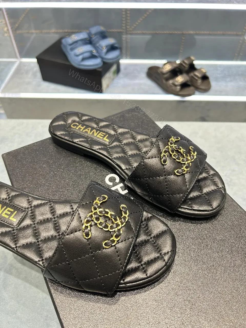 View 2 of Quilted Black Slides with Gold Emblem – Lux Slip-ons