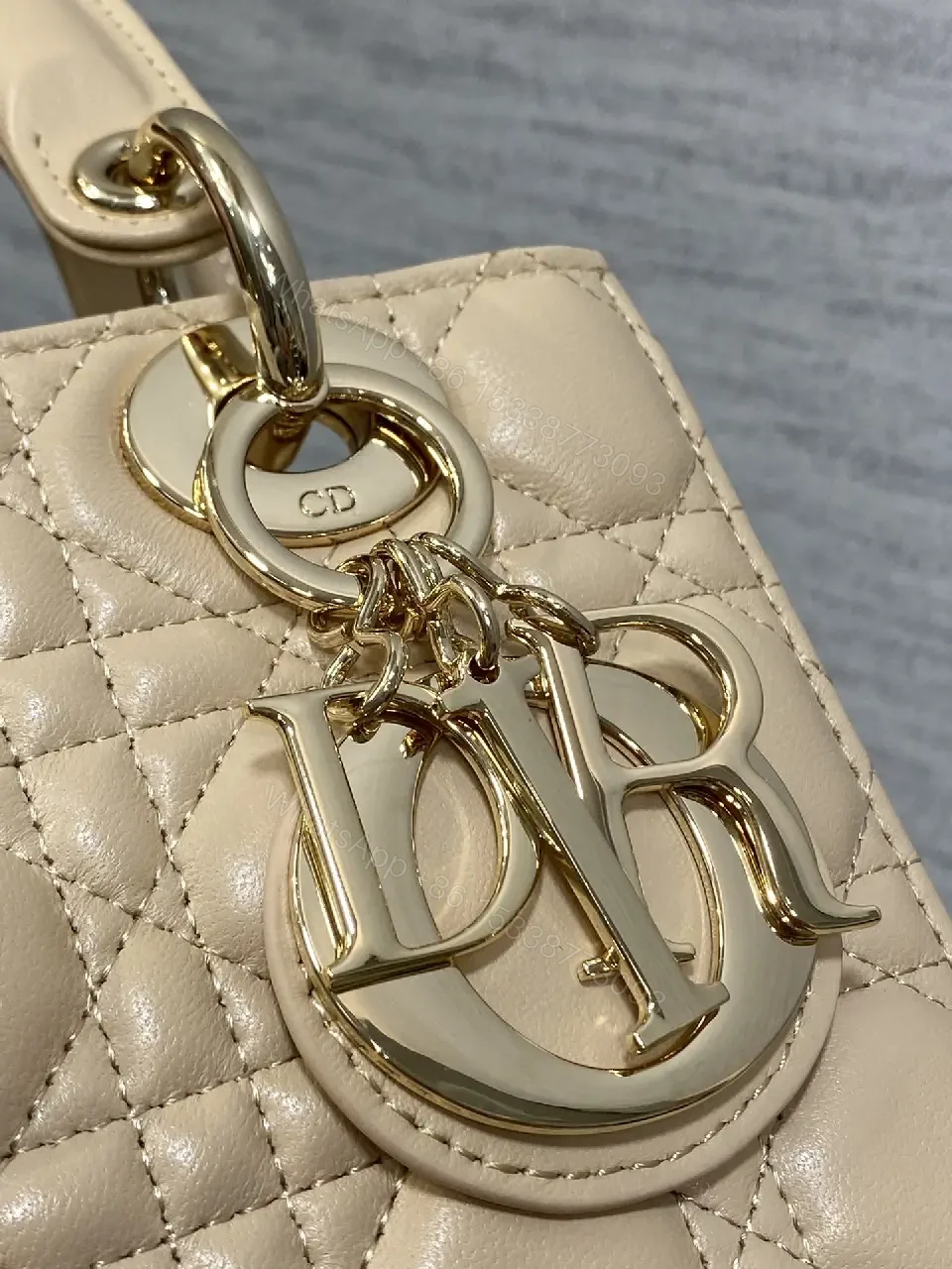 View 5 of Beige Quilted Leather Handbag with Top Handle for Everyday Luxury