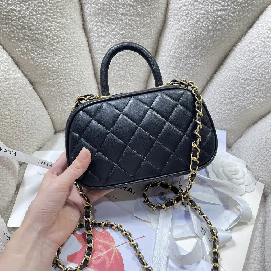 View 2 of Compact Black Quilted Handbag with Gold Logo Chain