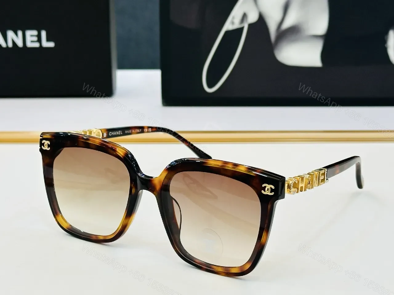 View 3 of Bold Black Frame Sunglasses with Gold Detailing