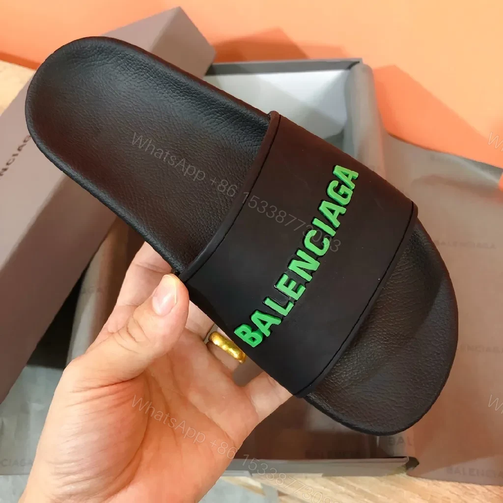 View 5 of Bold Neon Logo Slides: Black Comfort, Statement Style