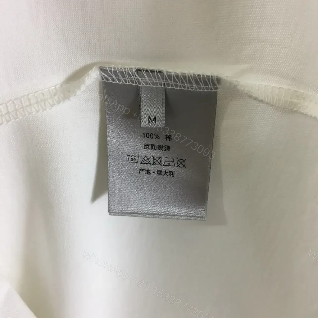 View 8 of Minimalist White Tee: Premium Cotton, Subtle Logo, Classic Fit tee