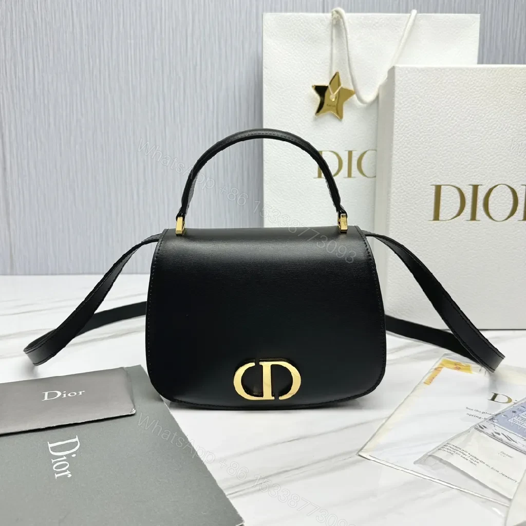 Chic Black Leather Saddle Bag with Gold Hardware — view 1