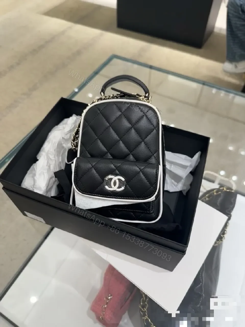 View 5 of Quilted Black Leather Mini Backpack – Luxe, Chain-strap Style
