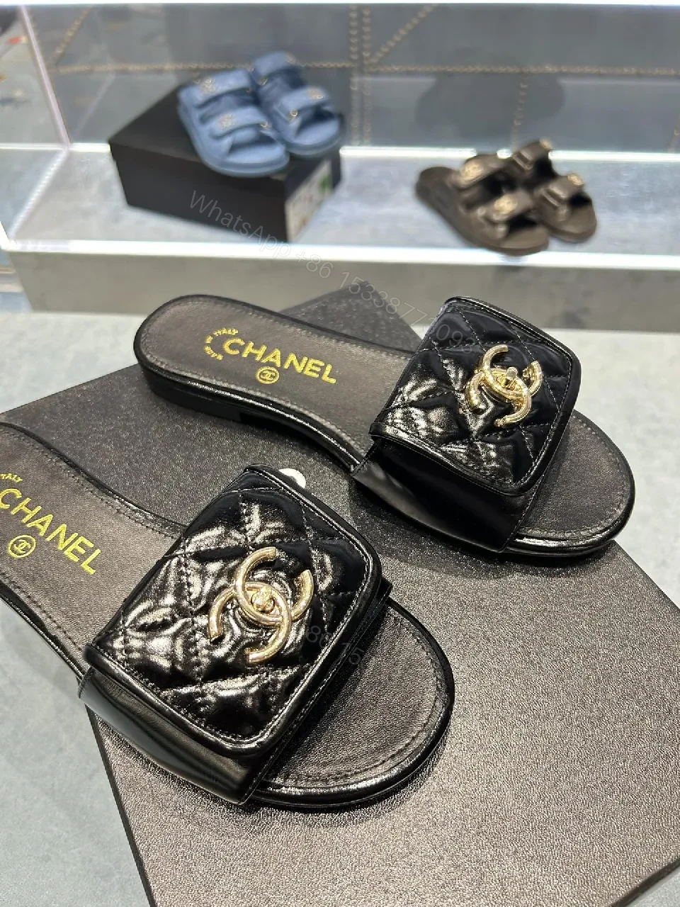 View 8 of Black Quilted Leather Slide with Gold Logo Escort