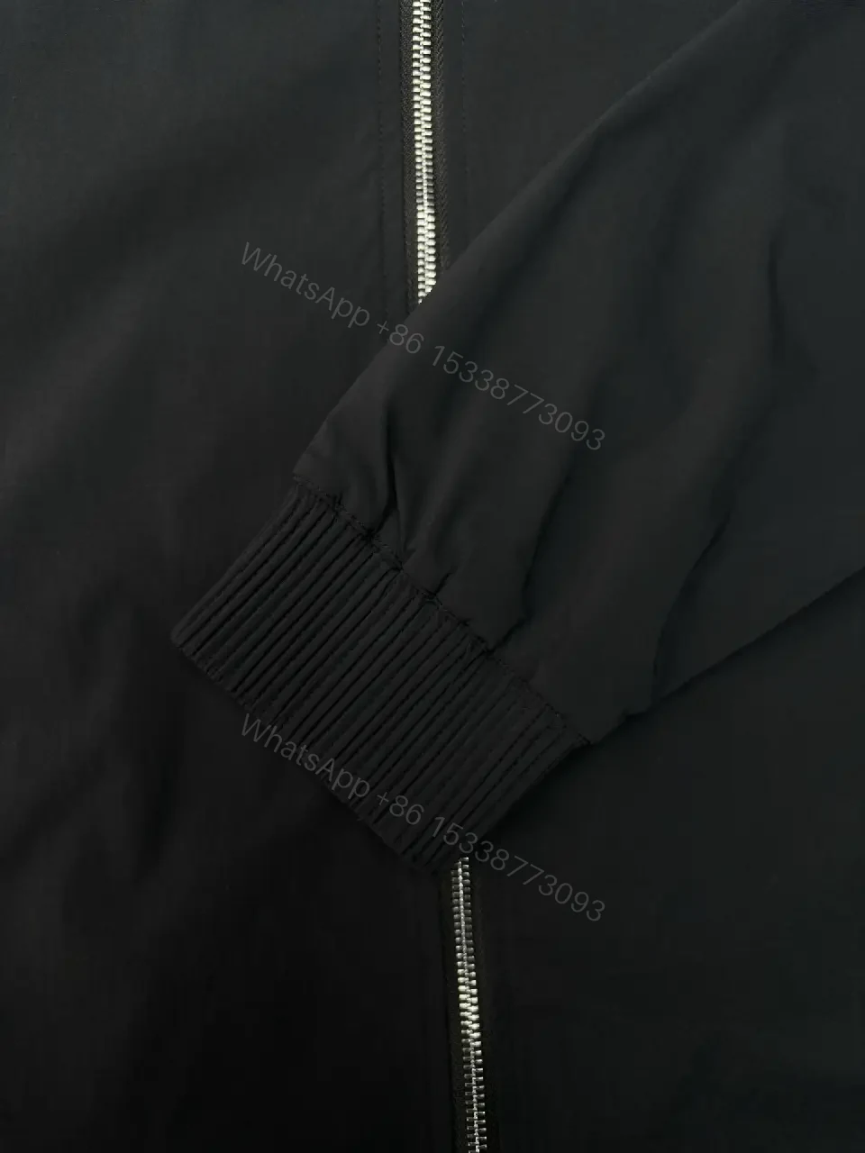 View 9 of Black Shell Bomber Jacket - Minimalist Luxury, Subtle Branding, Lightweight Warmth