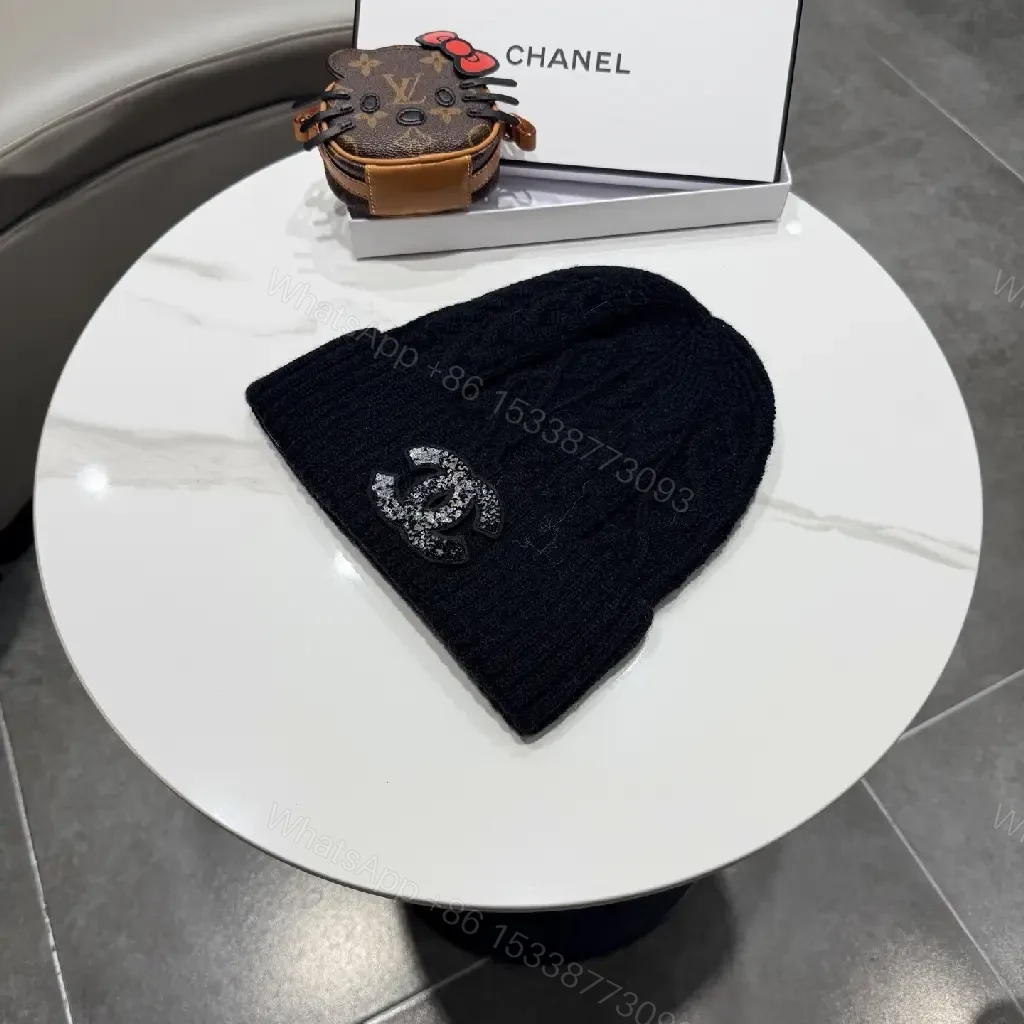 View 4 of Black Knit Beanie with Subtle Crest – Lux, All-Season Comfort