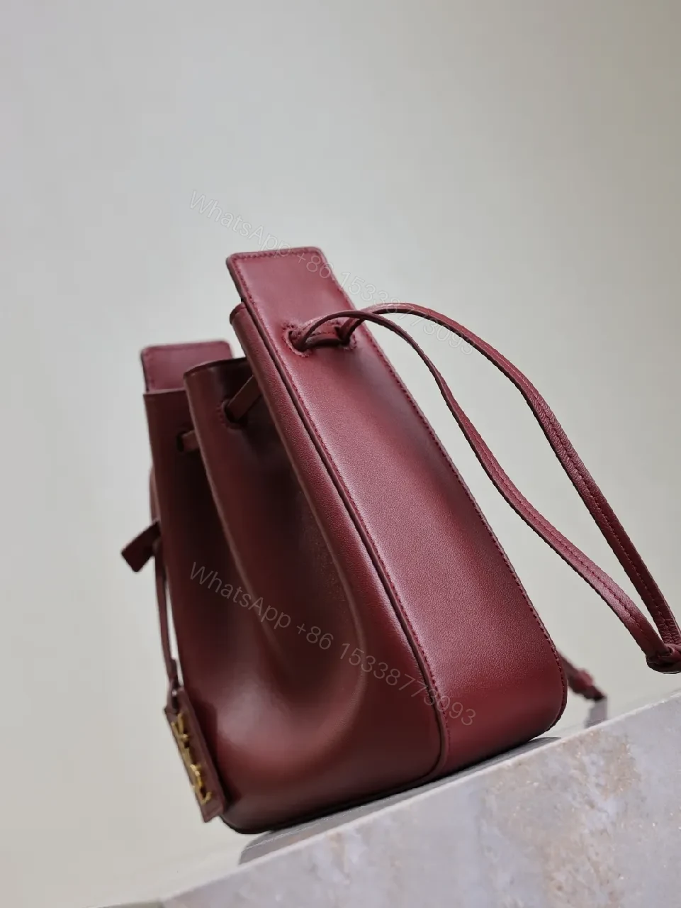 View 4 of Deep Bordeaux Leather Drawstring Bucket Bag—Elevated Everyday Style