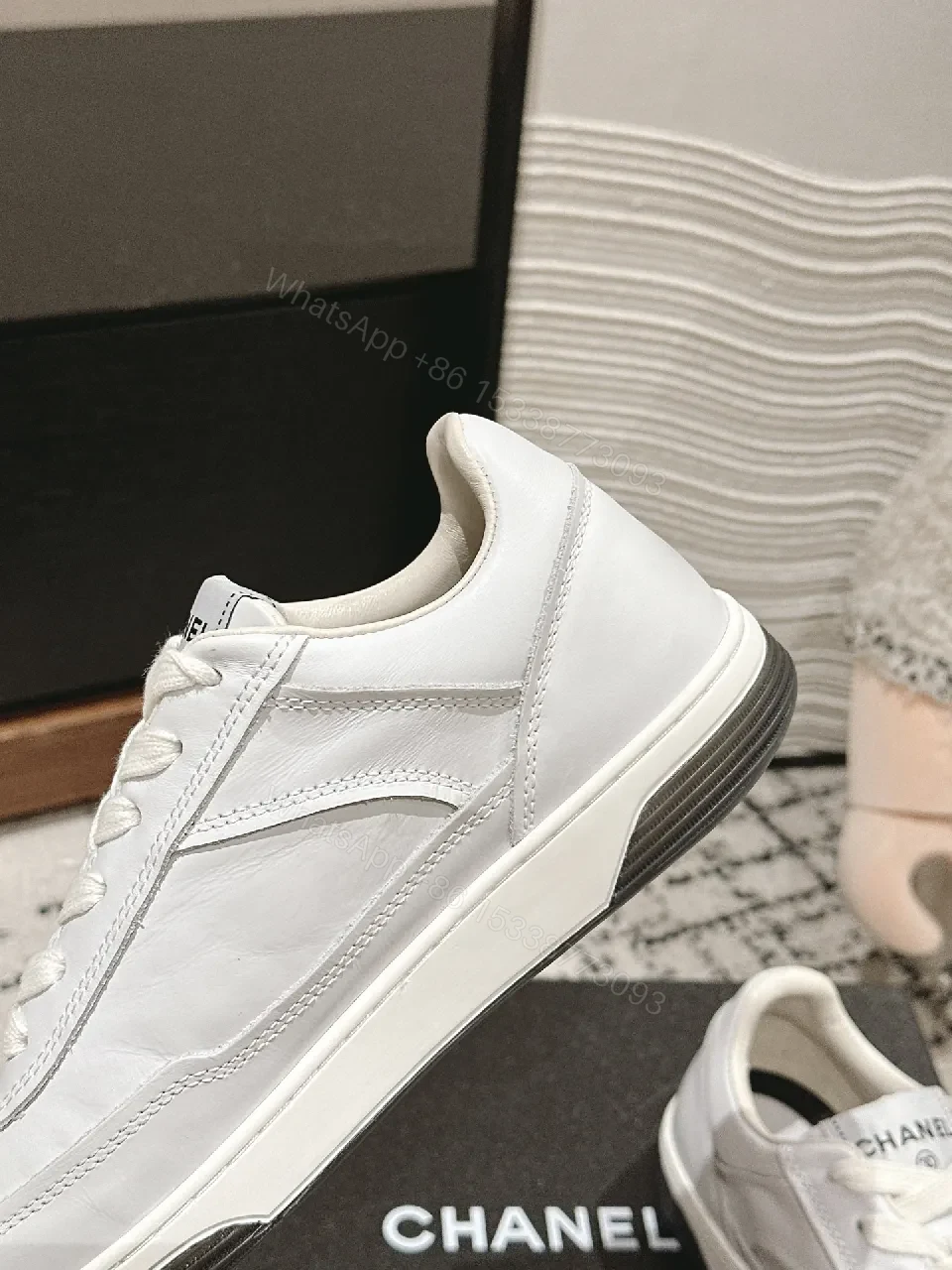 View 5 of Minimalist White Leather Sneakers with Subtle Chanel Detailing