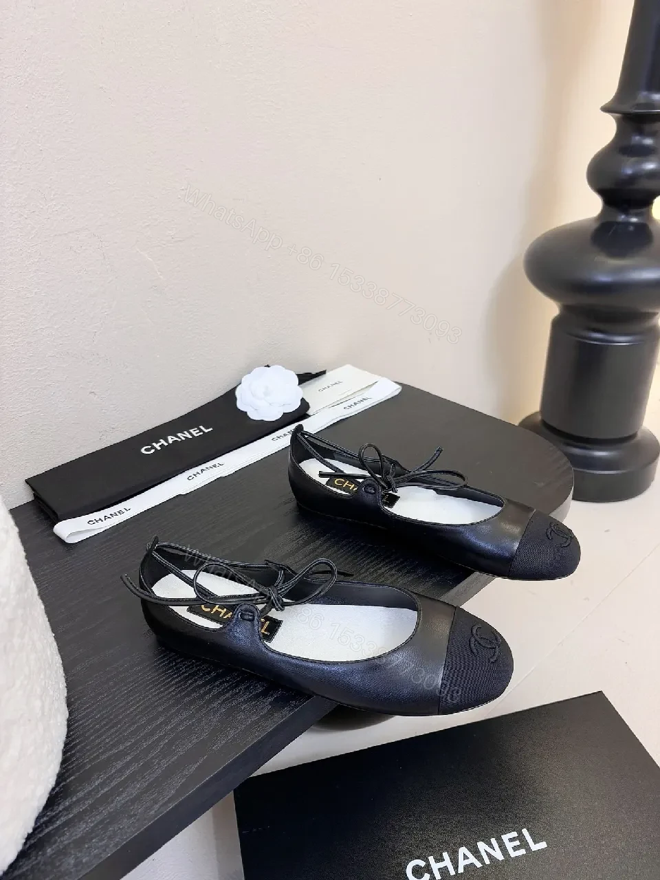 Chic Black Leather Ballet Flats with Subtle Logo Detailing — view 1
