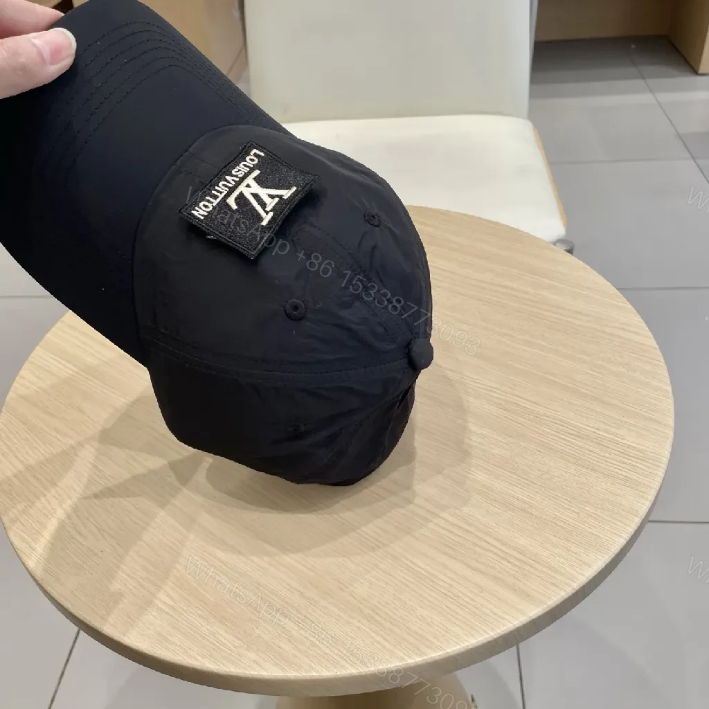View 5 of Compact Black Cap with Subtle LV Patch, Six-Panel, Adjustable Strap