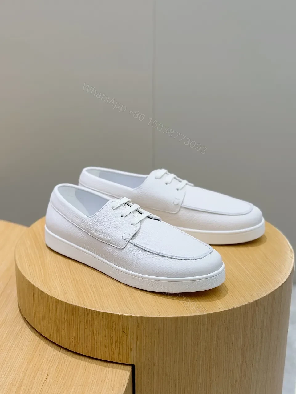 View 8 of Minimalist White Leather Low-Top Sneakers with Subtle Luxury Details