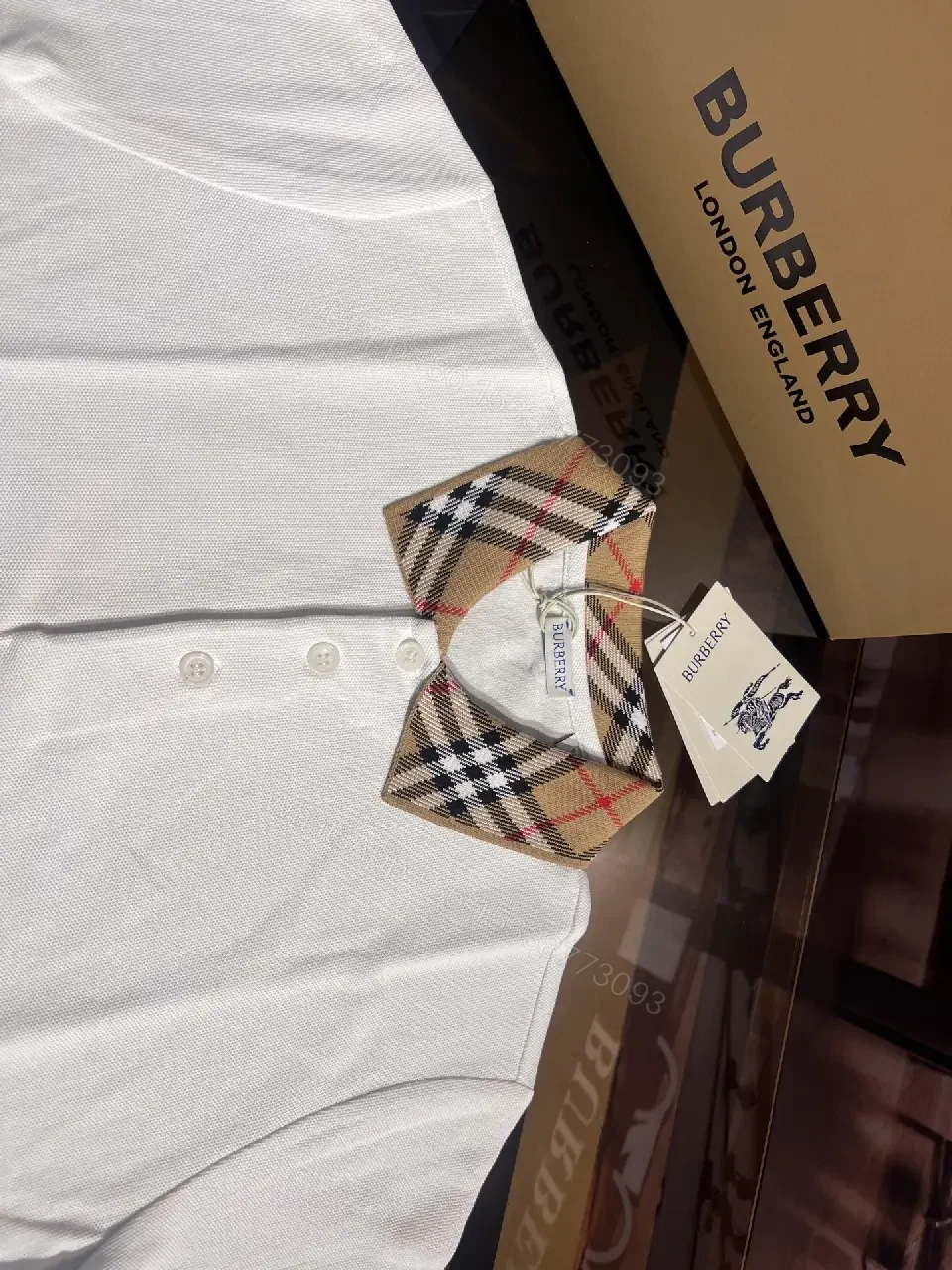 View 9 of White Piqué Polo with Signature Check Collar - Contemporary Luxury
