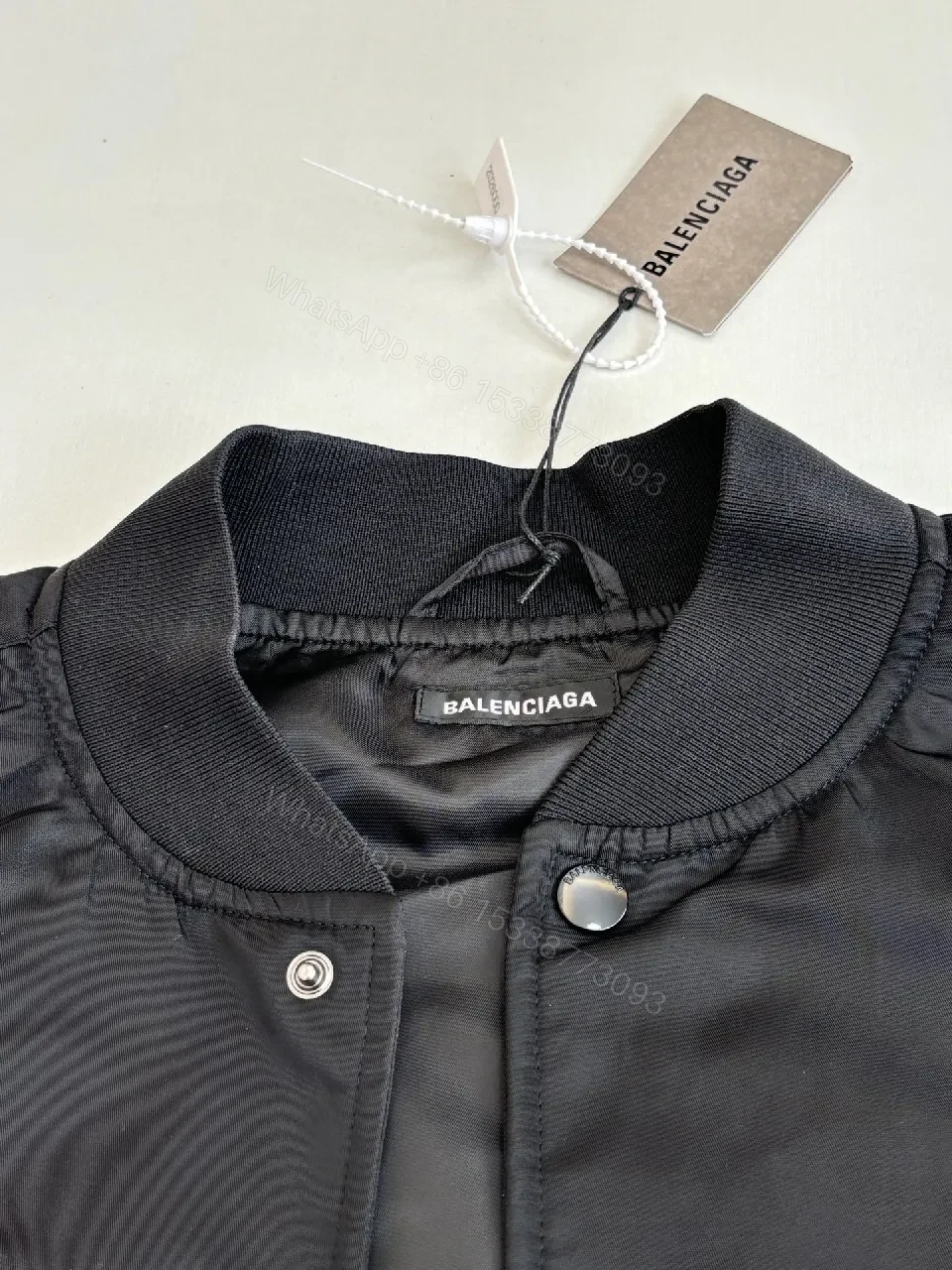 View 10 of Bold Black Logo Varsity Jacket | Luxe Streetwear Outerwear