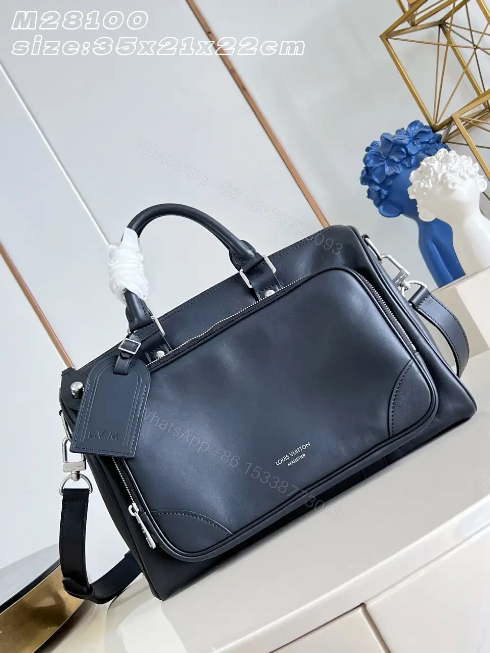 View 3 of Black leather structured satchel with top handle, removable strap, smooth finish, Louis Vuitton Paris (no brand details)