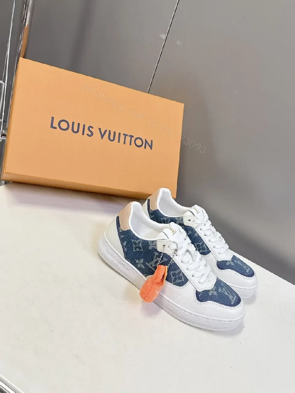 View 6 of Denim-Accent Luxury Sneakers with LV Flair