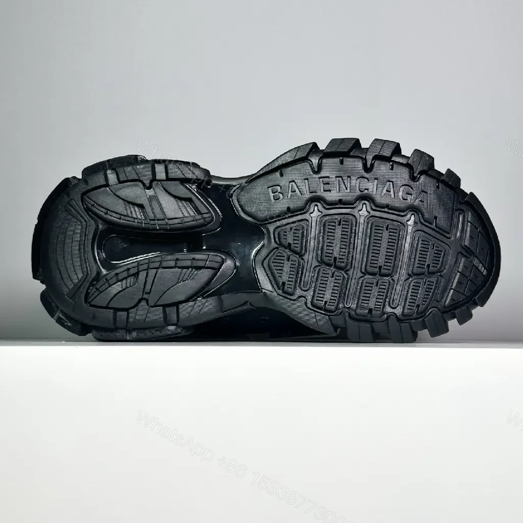View 6 of black leather and mesh sneakers with logo motif for luxury streetwear