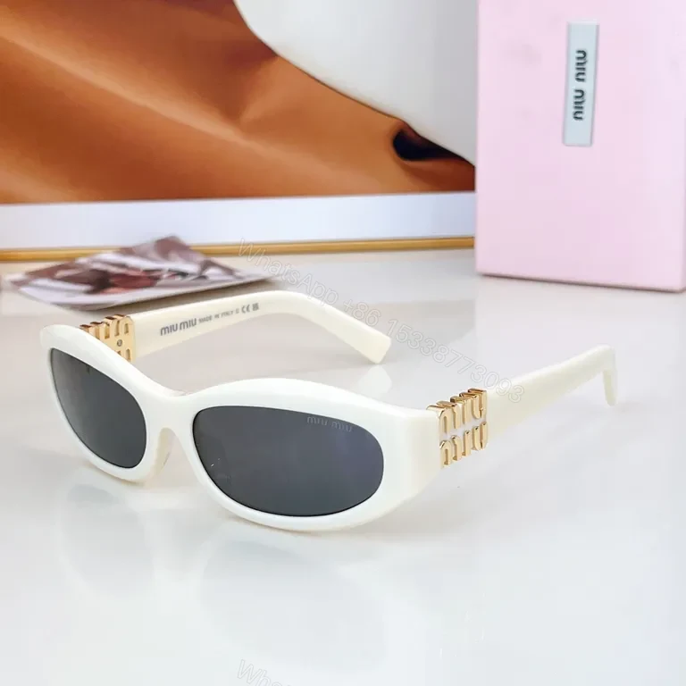View 3 of Chic Black Miu Miu Sunglasses with Gold Accent - All-Day Shield