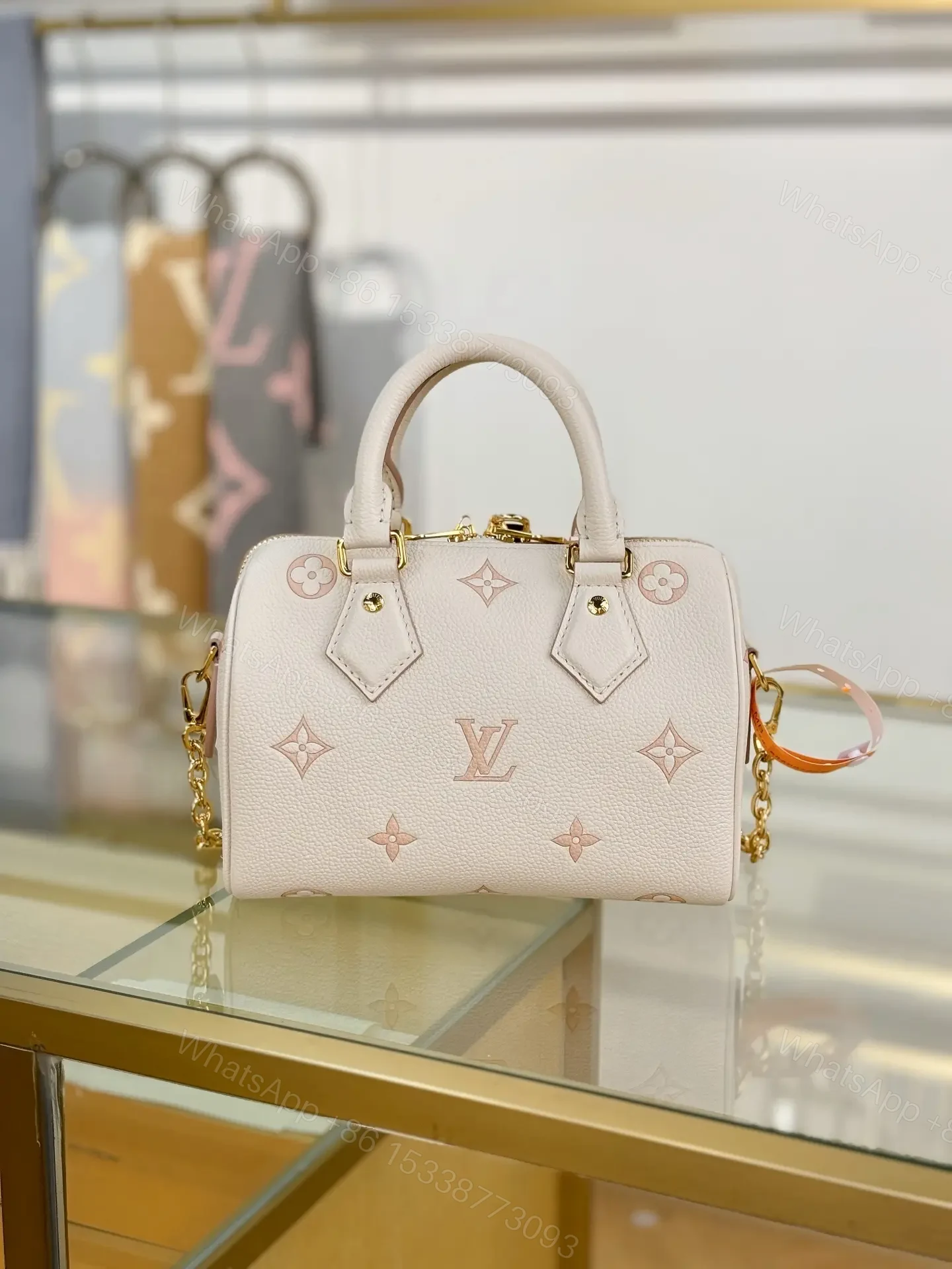 View 5 of Louis Vuitton Monogram Empreinte Bicolor Speedy Bandoulière 20