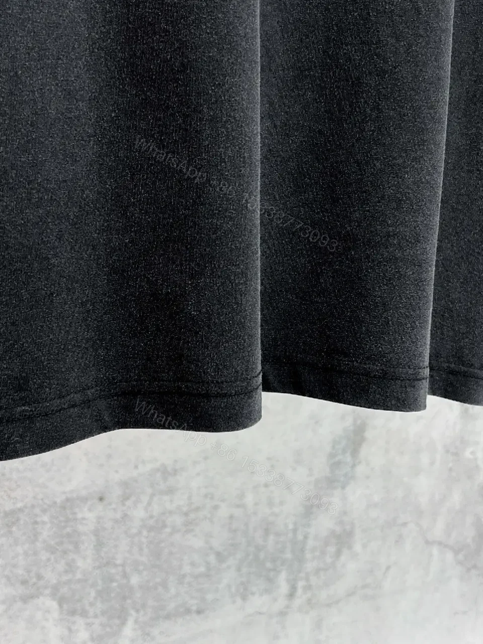 View 11 of Oversized Black Cotton Tee with Distressed Logo – Avant-Garde Streetwear