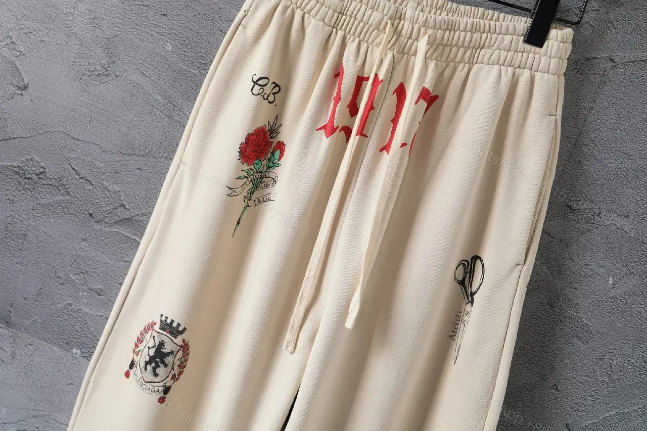 View 5 of Beige Wide-Leg Pants with Drawstring and Embroidered Patches